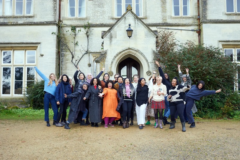 The collective celebrating outside Hawkwood College, Stroud