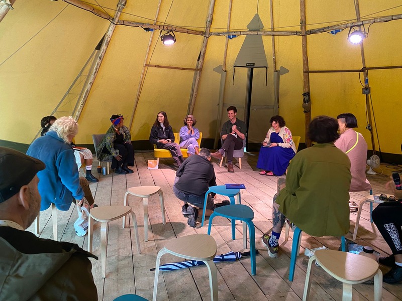 Community listening session inside a tipi at the Eden Project